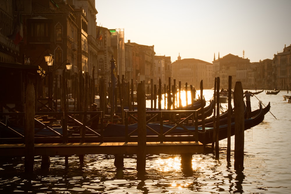 a couple of gondolas that are sitting in the water