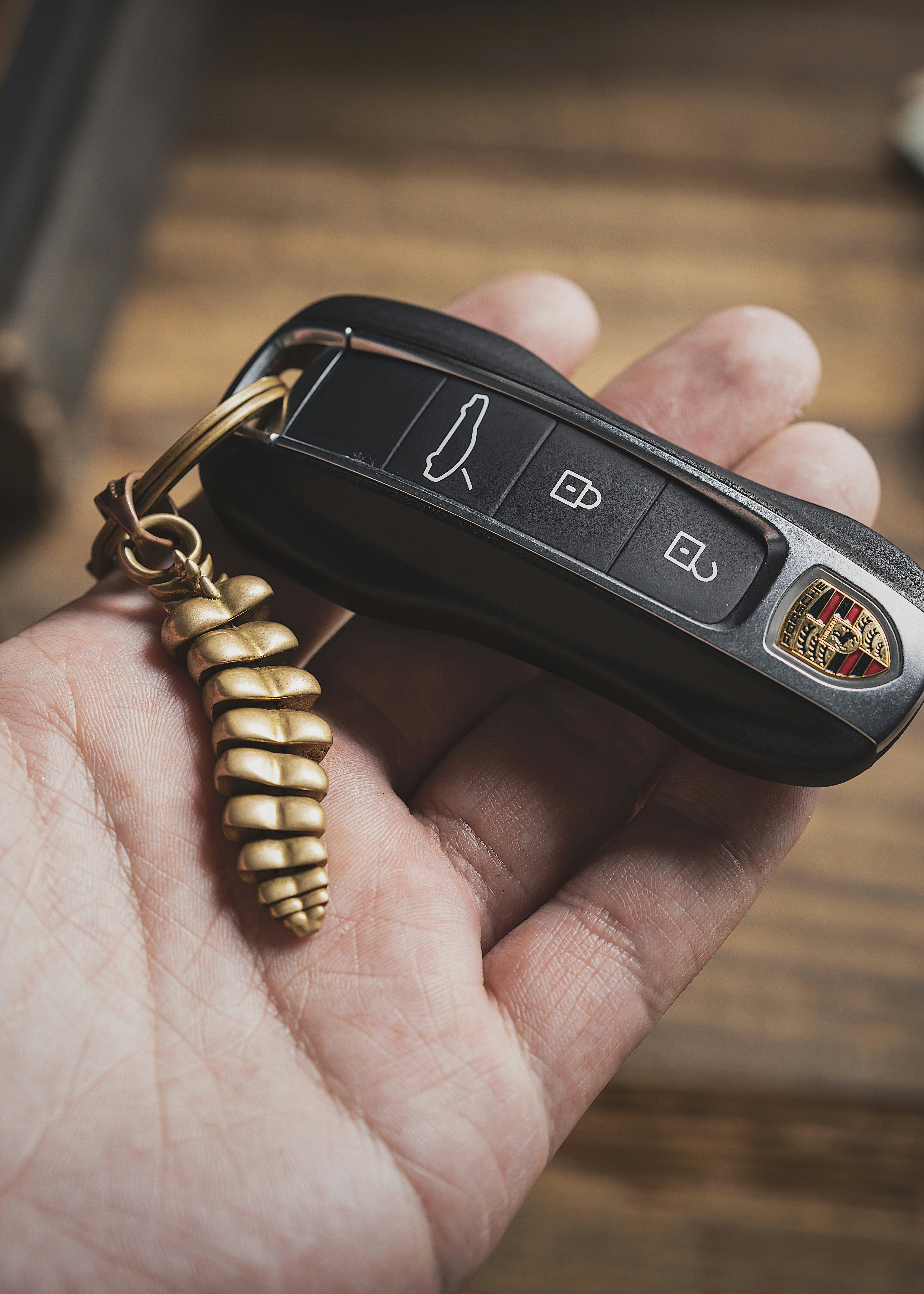 a person holding a car key in their hand