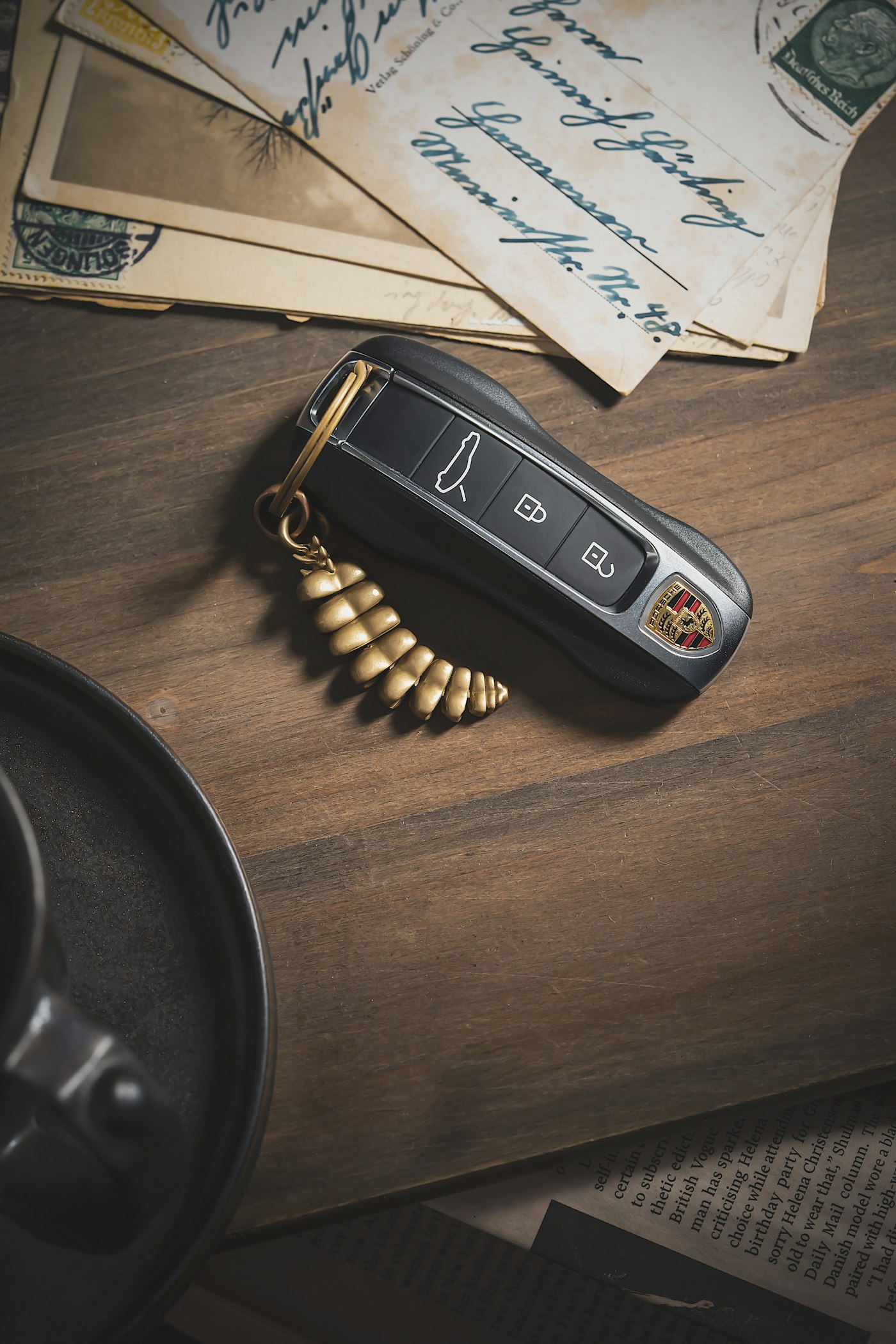 A keyless car fob lying on a wooden table by the front door