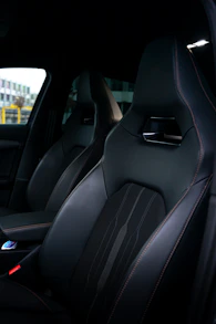 Interior shot showing spotless leather seats and dashboard freshly detailed by Primal Blue