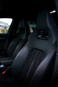 Interior shot showing spotless leather seats and dashboard freshly detailed by Primal Blue