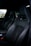 An interior view of a freshly detailed car with spotless seats and dashboard.