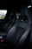 Close-up of a shiny, freshly detailed car dashboard and leather seats.