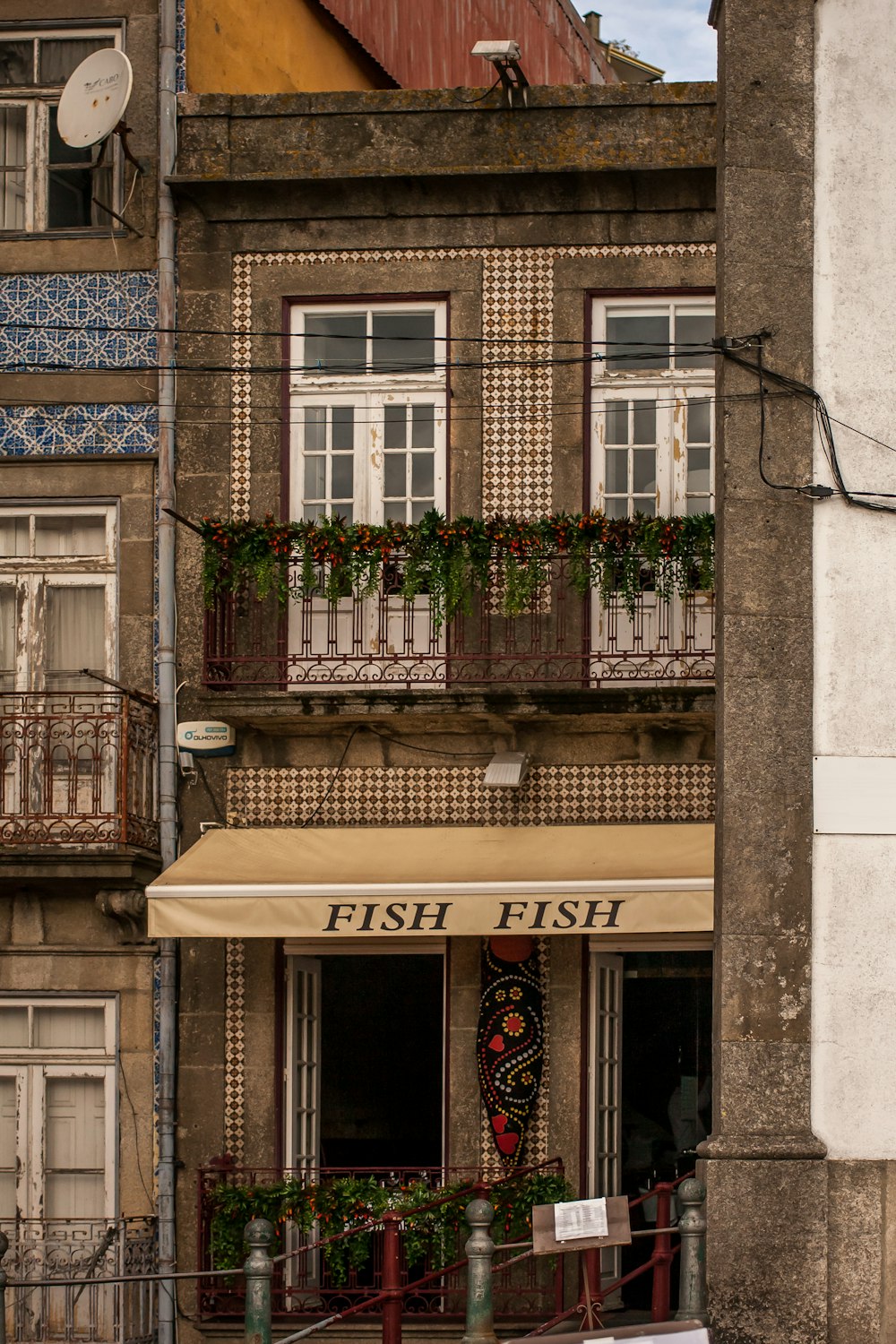 a building with a fish fish restaurant in front of it
