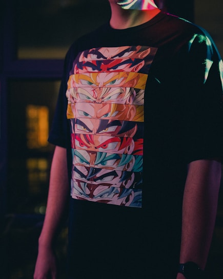 a man wearing a t - shirt with a colorful design on it