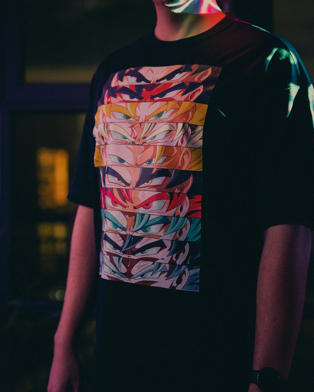 a man wearing a t - shirt with a colorful design on it