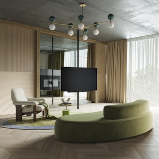 a living room filled with furniture and a flat screen tv