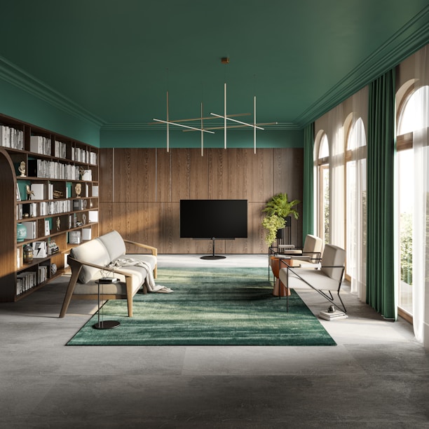 A sleek modern living room illuminated by smart, adjustable LED lighting with teal and cyan hues.