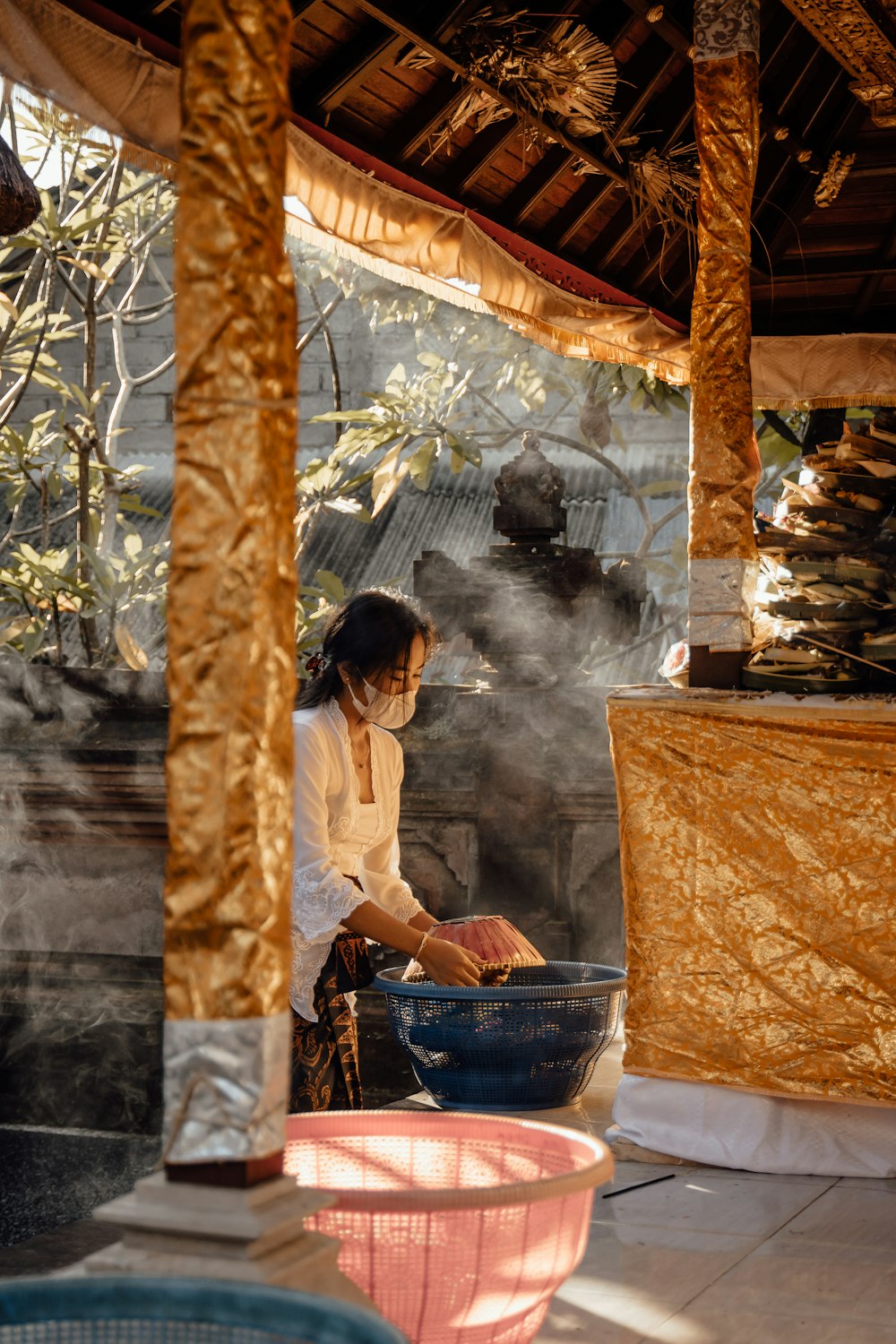 a woman cooking food in a large bowl