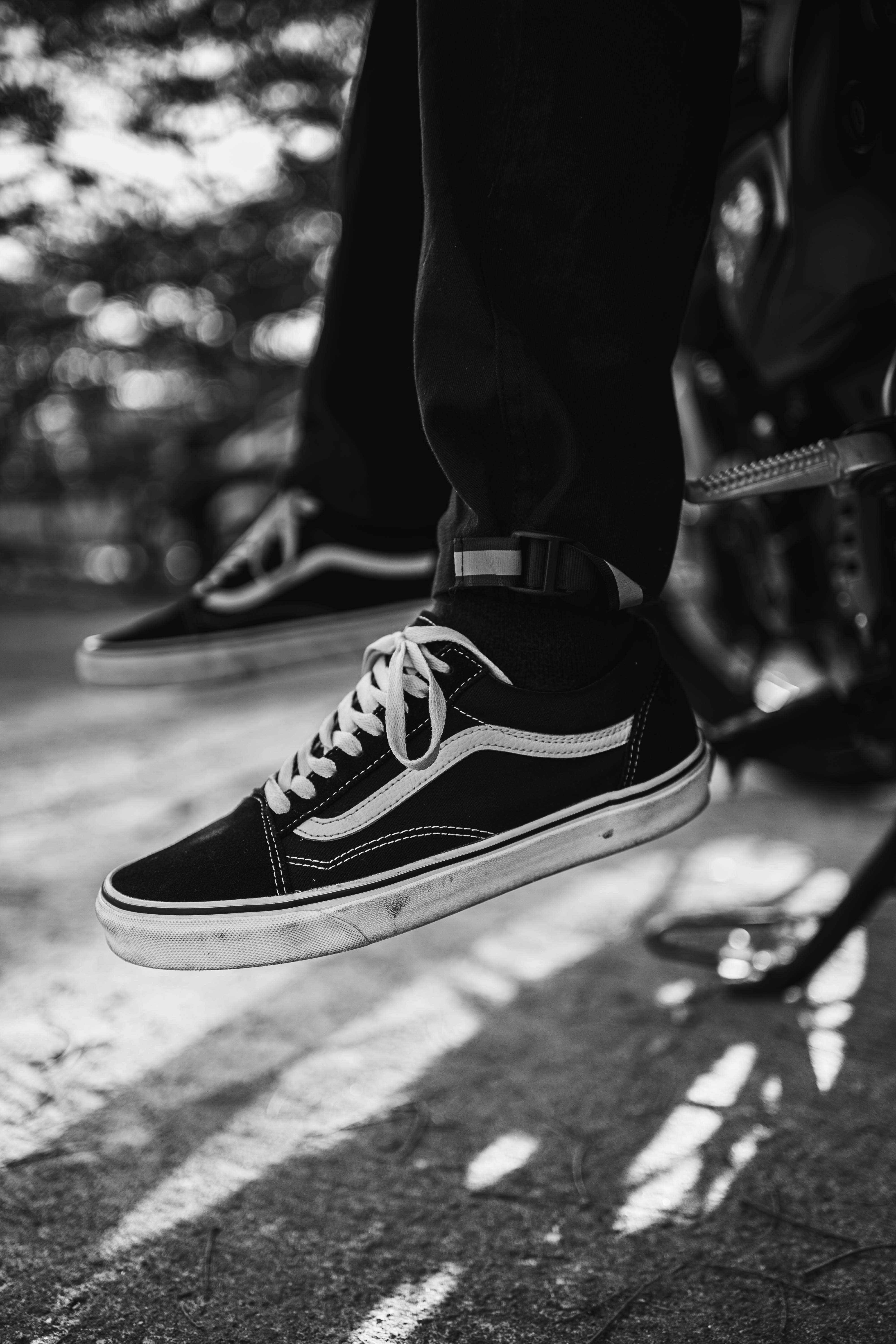 a black and white photo of a person's shoes