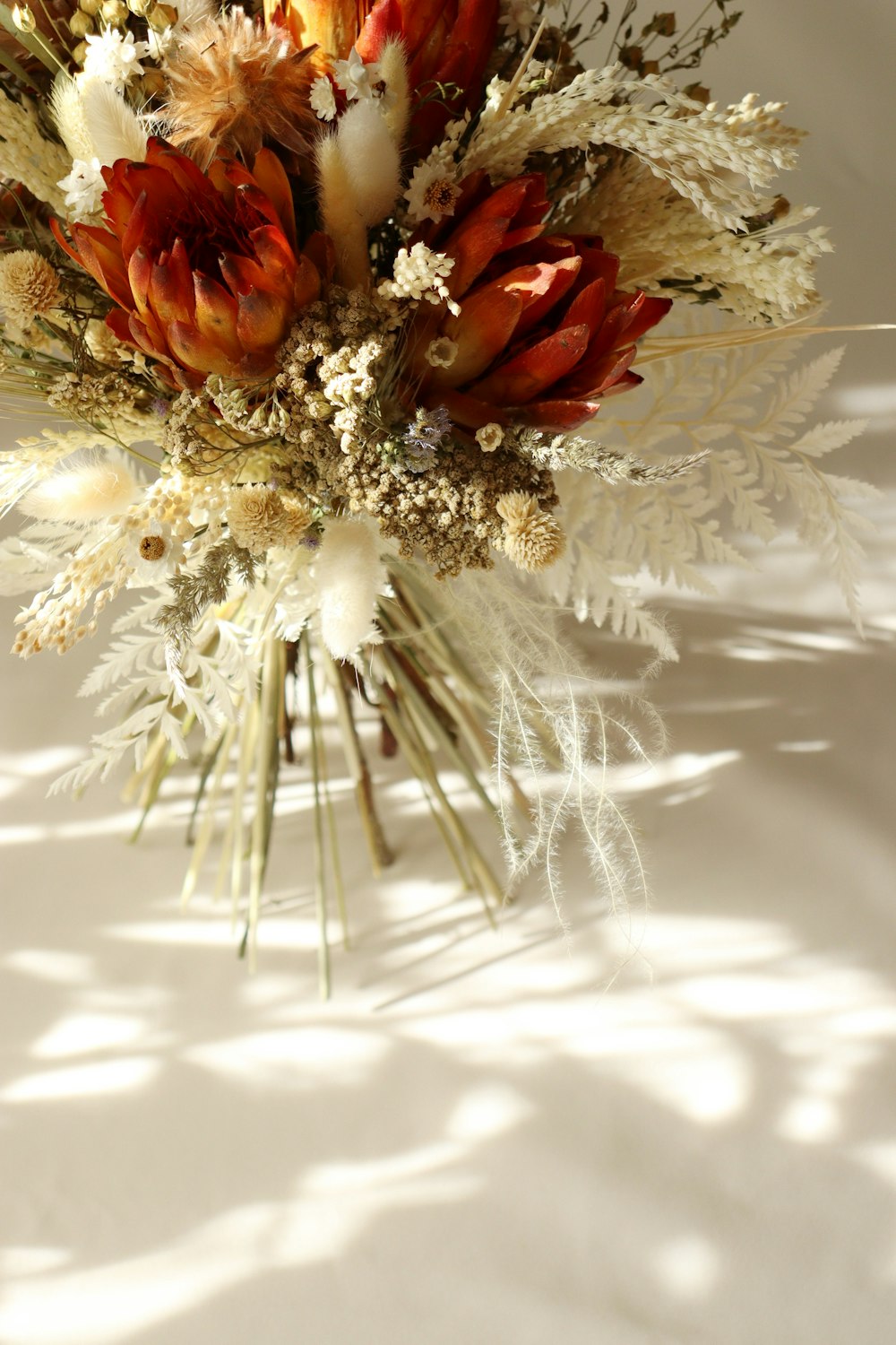 a bouquet of flowers sitting on top of a table