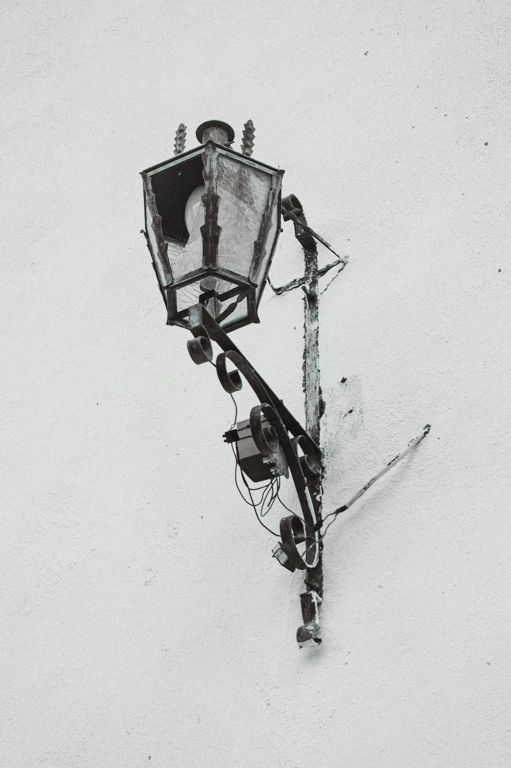 a street light on a pole in the snow