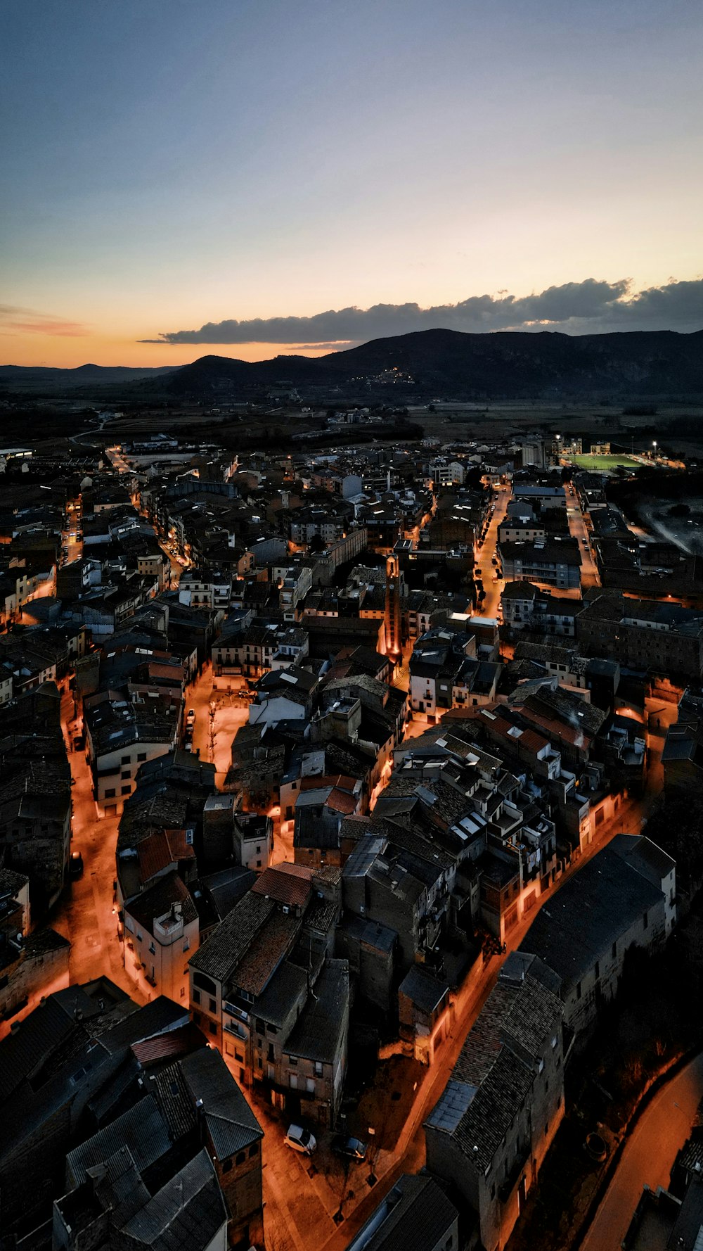 an aerial view of a city at night