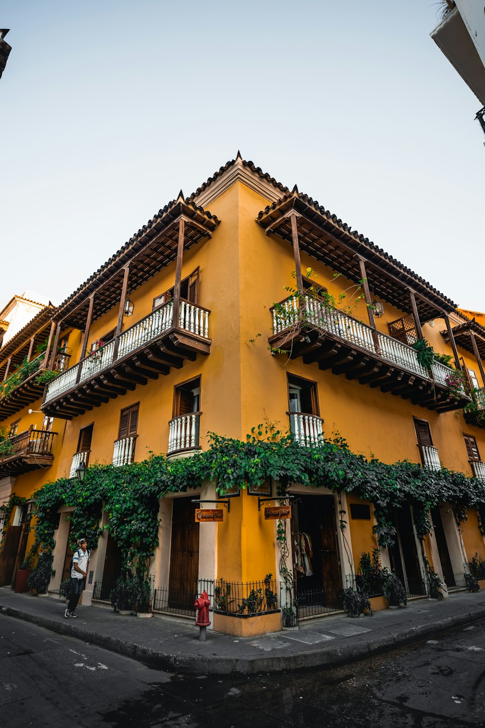 a tall yellow building with lots of windows