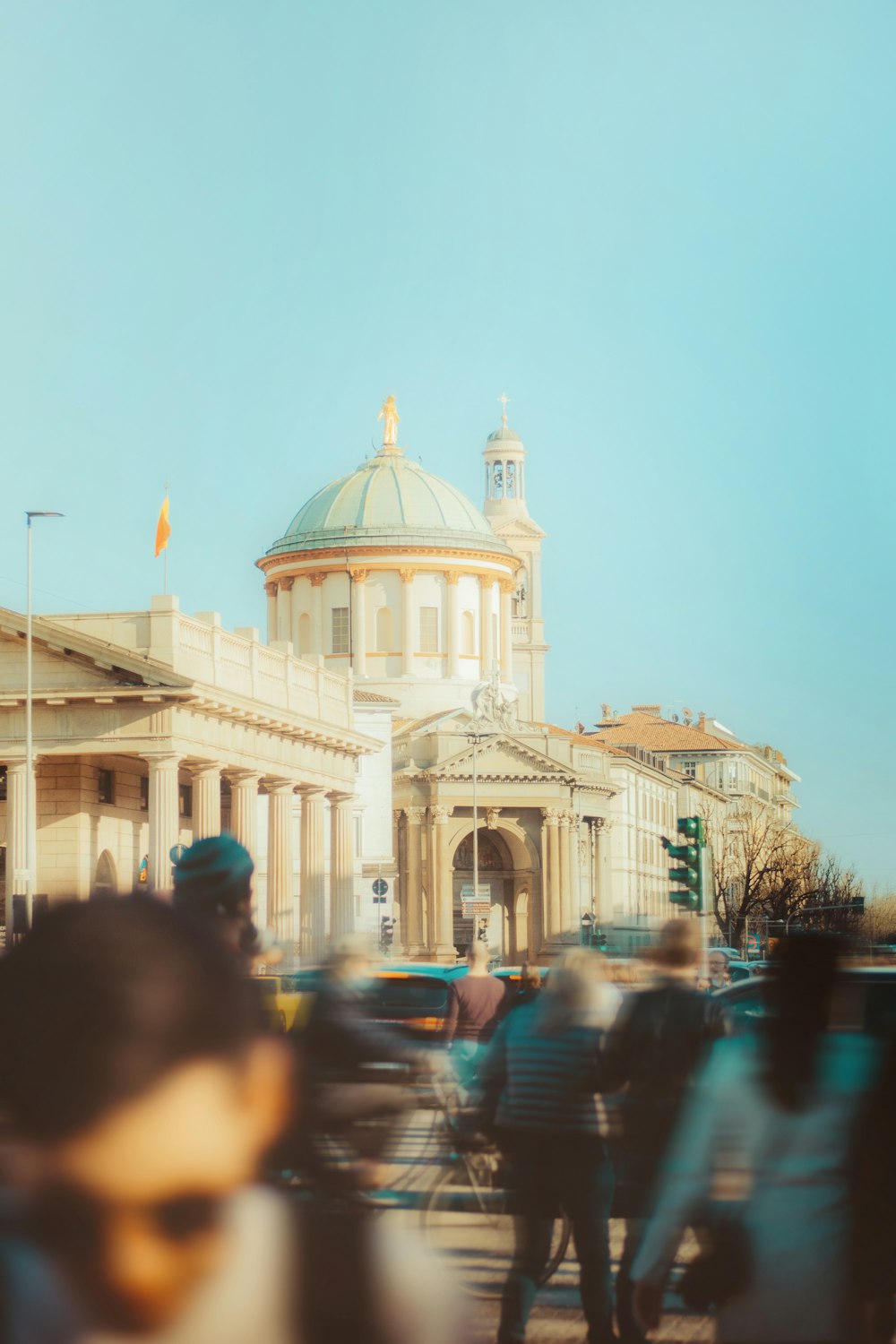 a blurry photo of people walking in front of a building