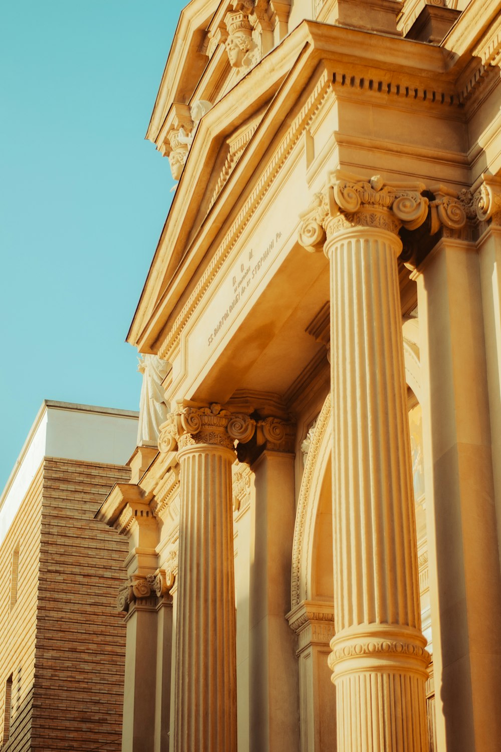 an old building with columns and a clock tower