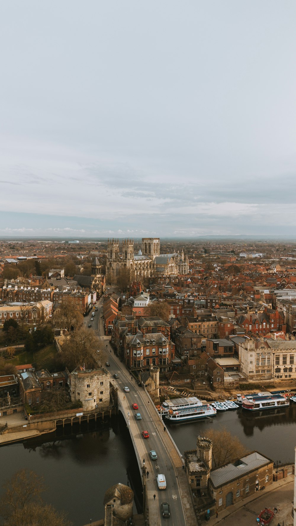 an aerial view of a city with a bridge