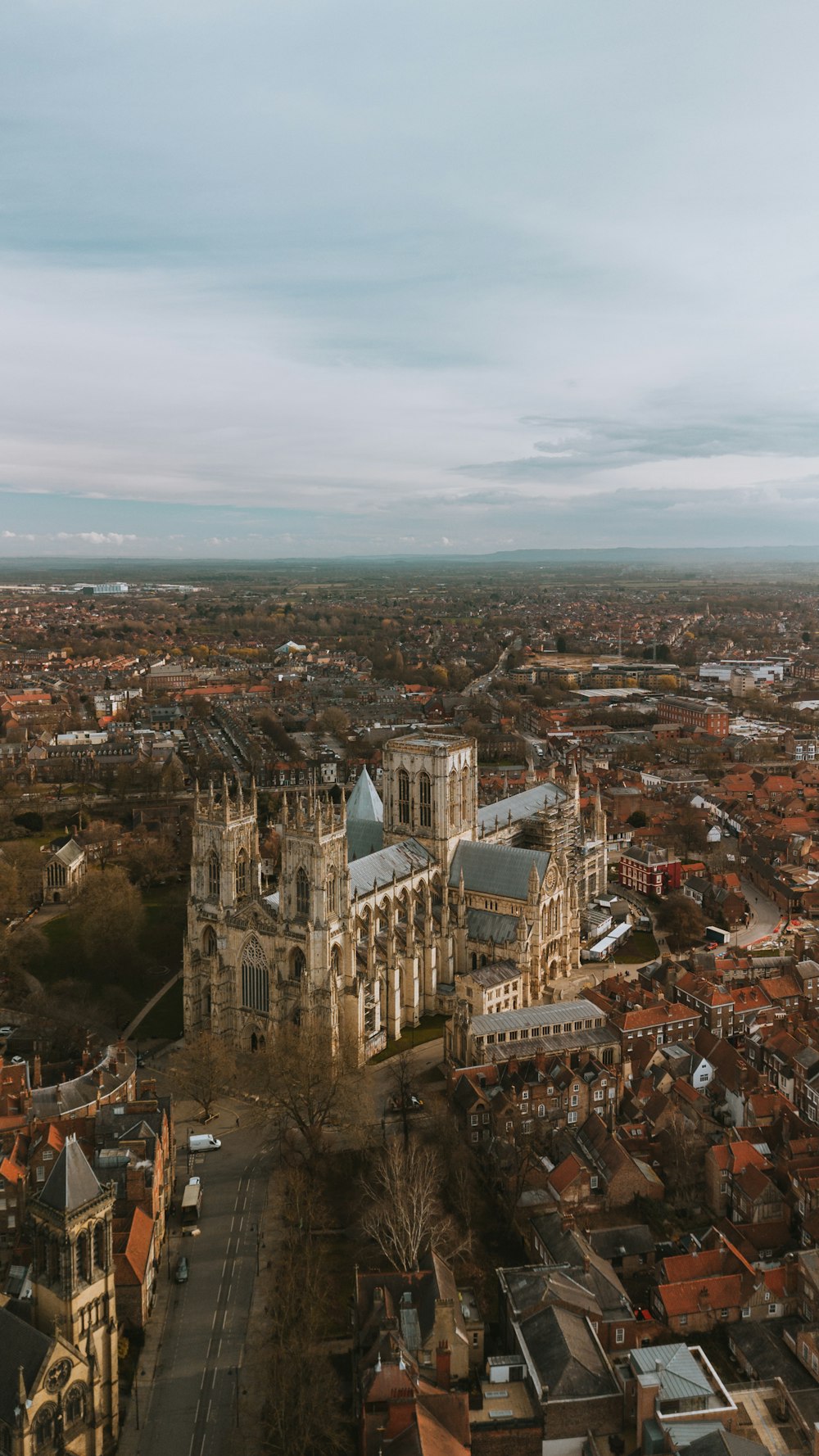 an aerial view of a city with a cathedral