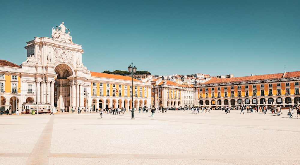 a large building with a lot of people walking around it