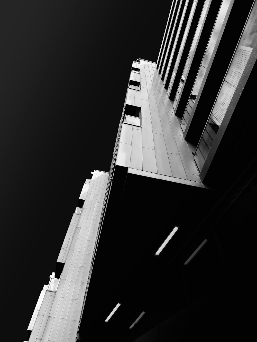 a black and white photo of a tall building