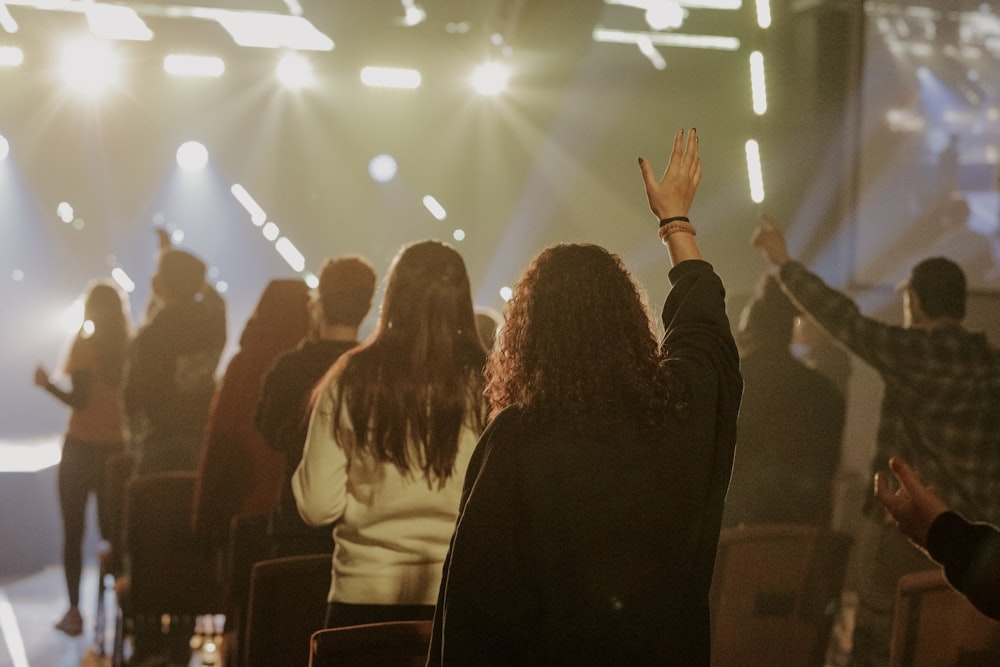 a group of people standing on top of a stage