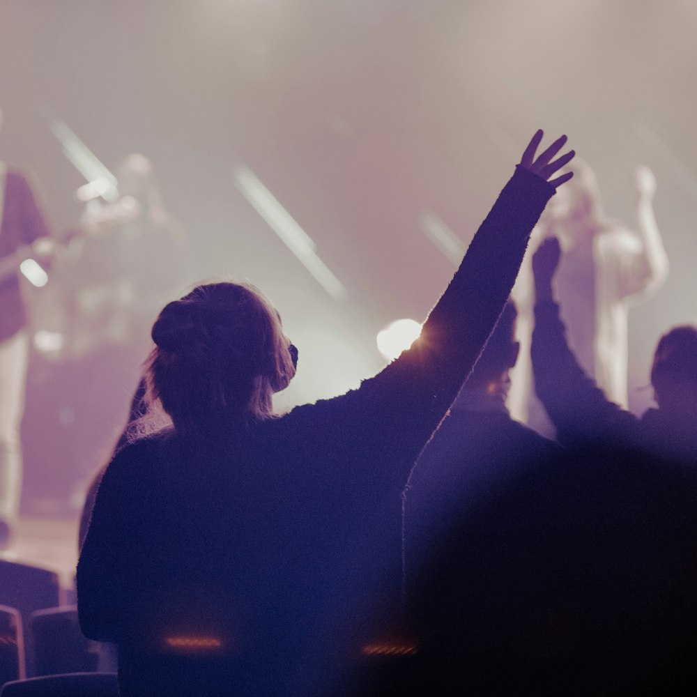 a group of people standing on top of a stage