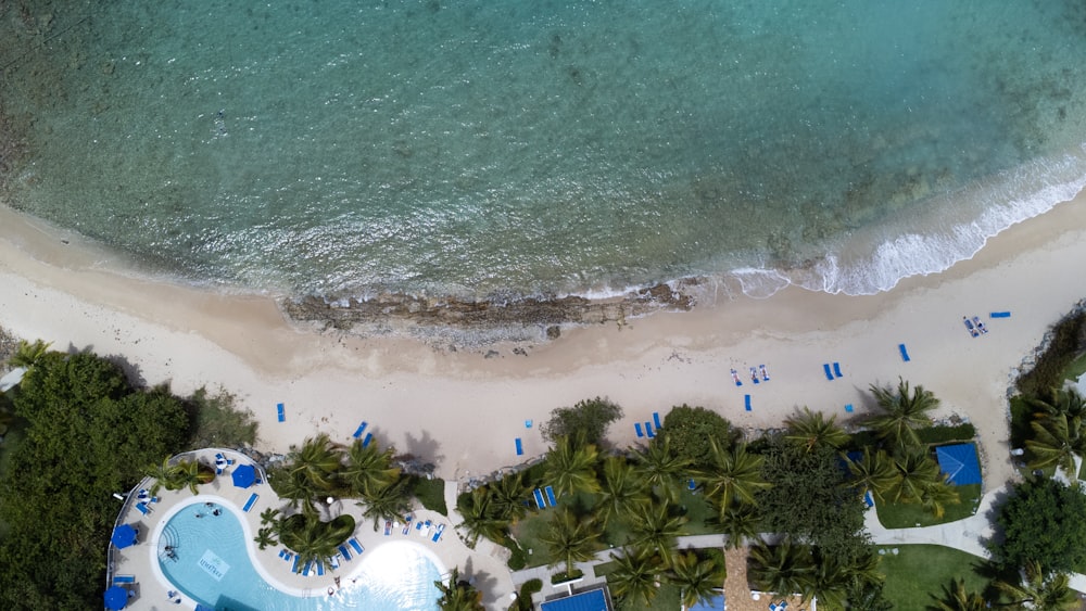 a bird's eye view of a beach and pool