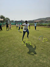 a group of young men playing a game of frisbee