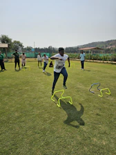 a group of young men playing a game of frisbee