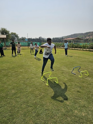 a group of young men playing a game of frisbee
