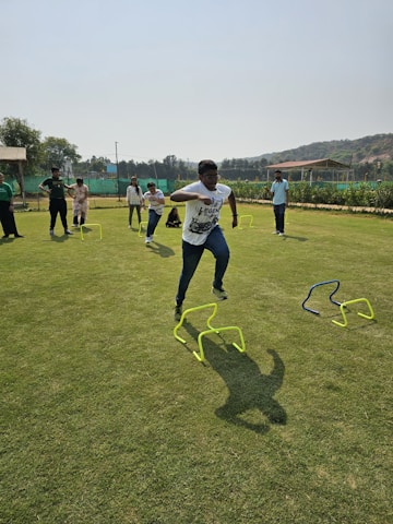 a group of young men playing a game of frisbee