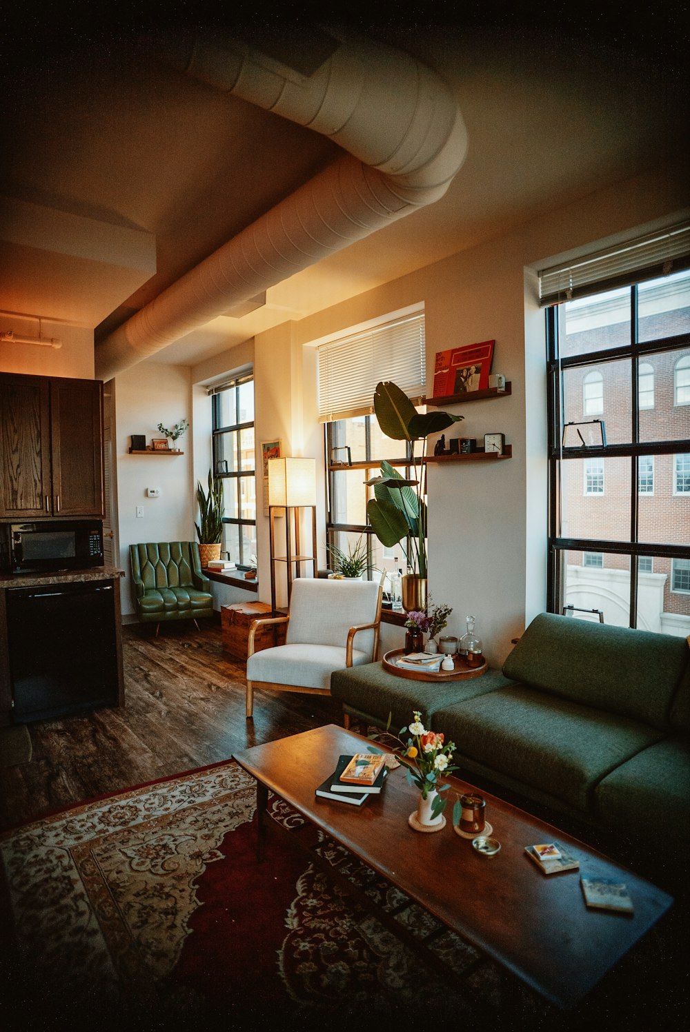 a living room filled with furniture and a large window