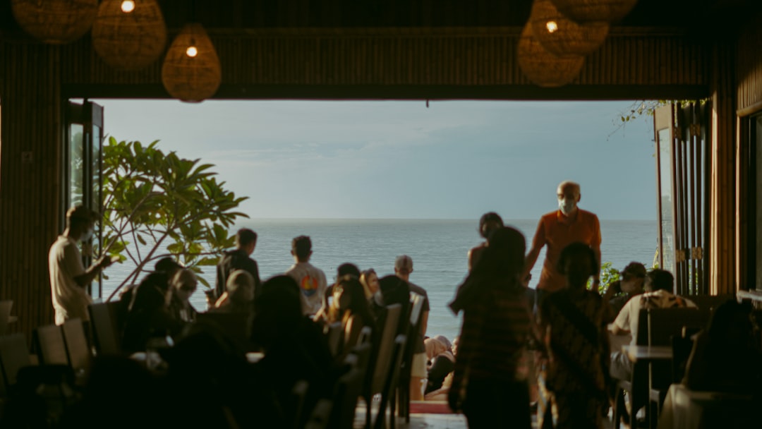 a group of people standing in front of an open door