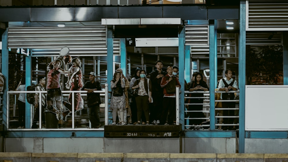 a group of people standing outside of a building