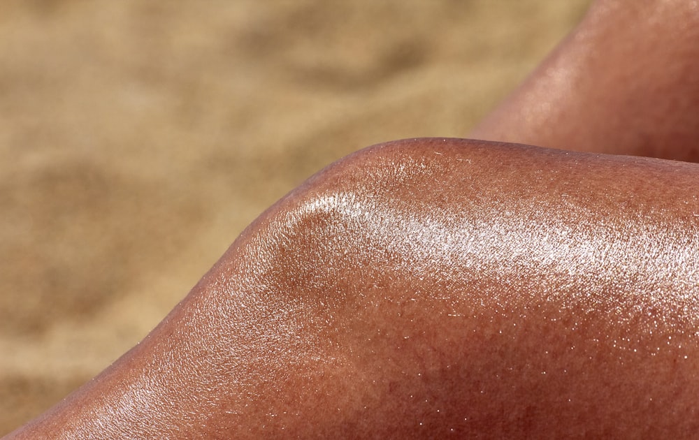 a close up of a person's tanning legs