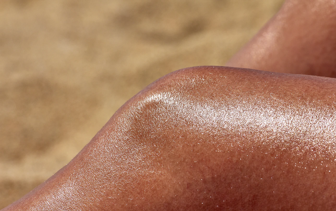 Close-up of freshly spray-tanned legs with an even bronze finish