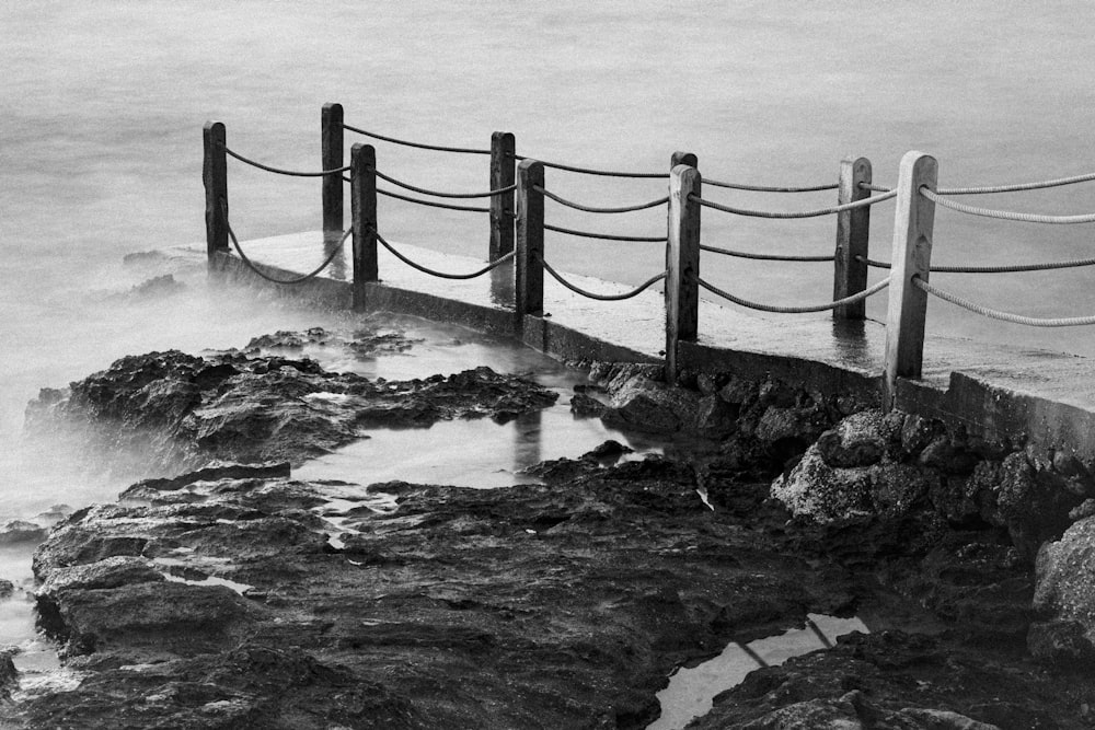 a black and white photo of a rocky shore