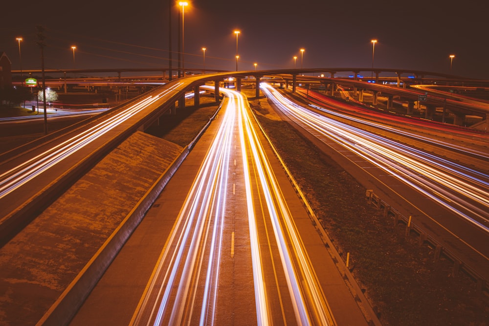 a highway filled with lots of traffic at night