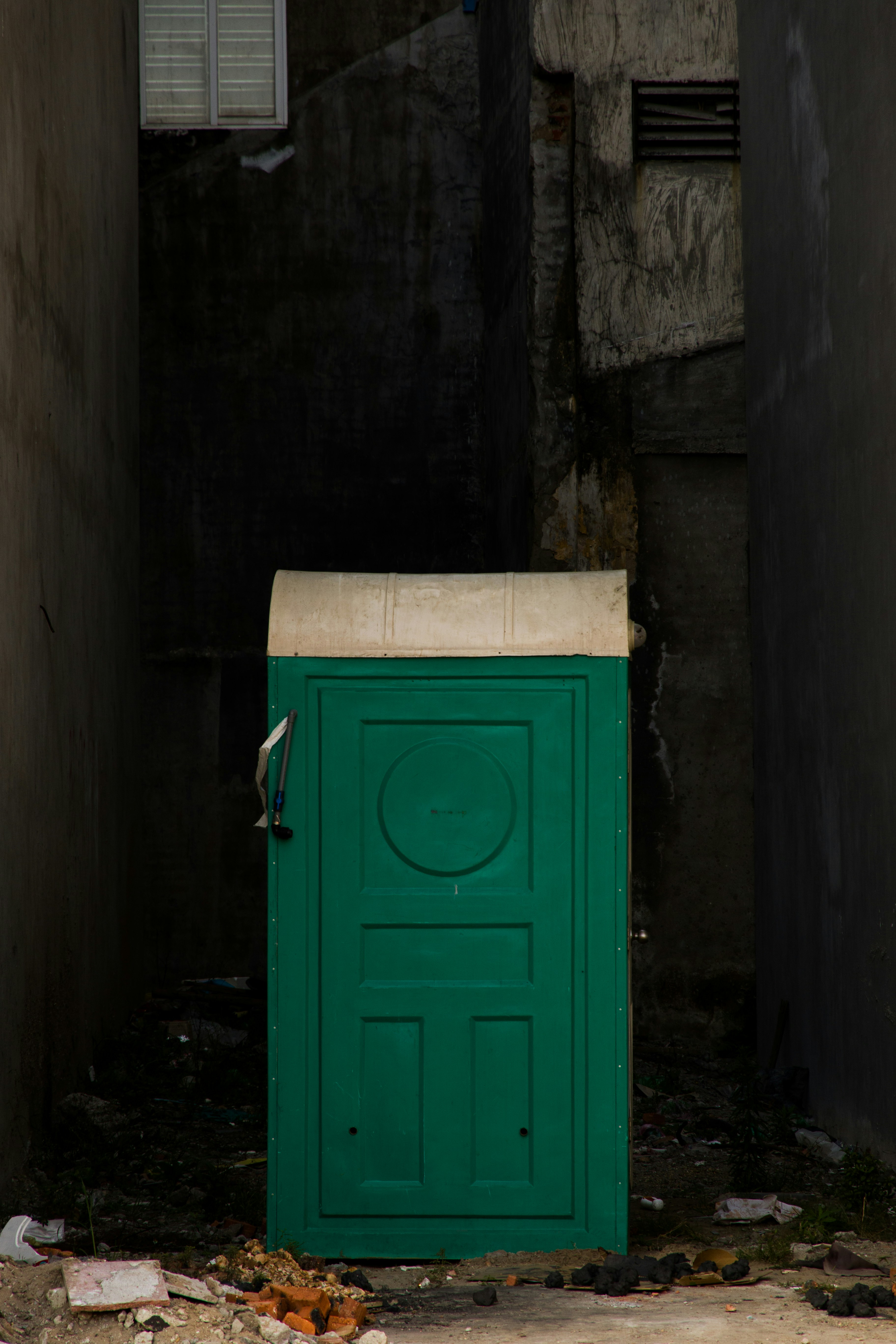 a green box sitting in the middle of a room