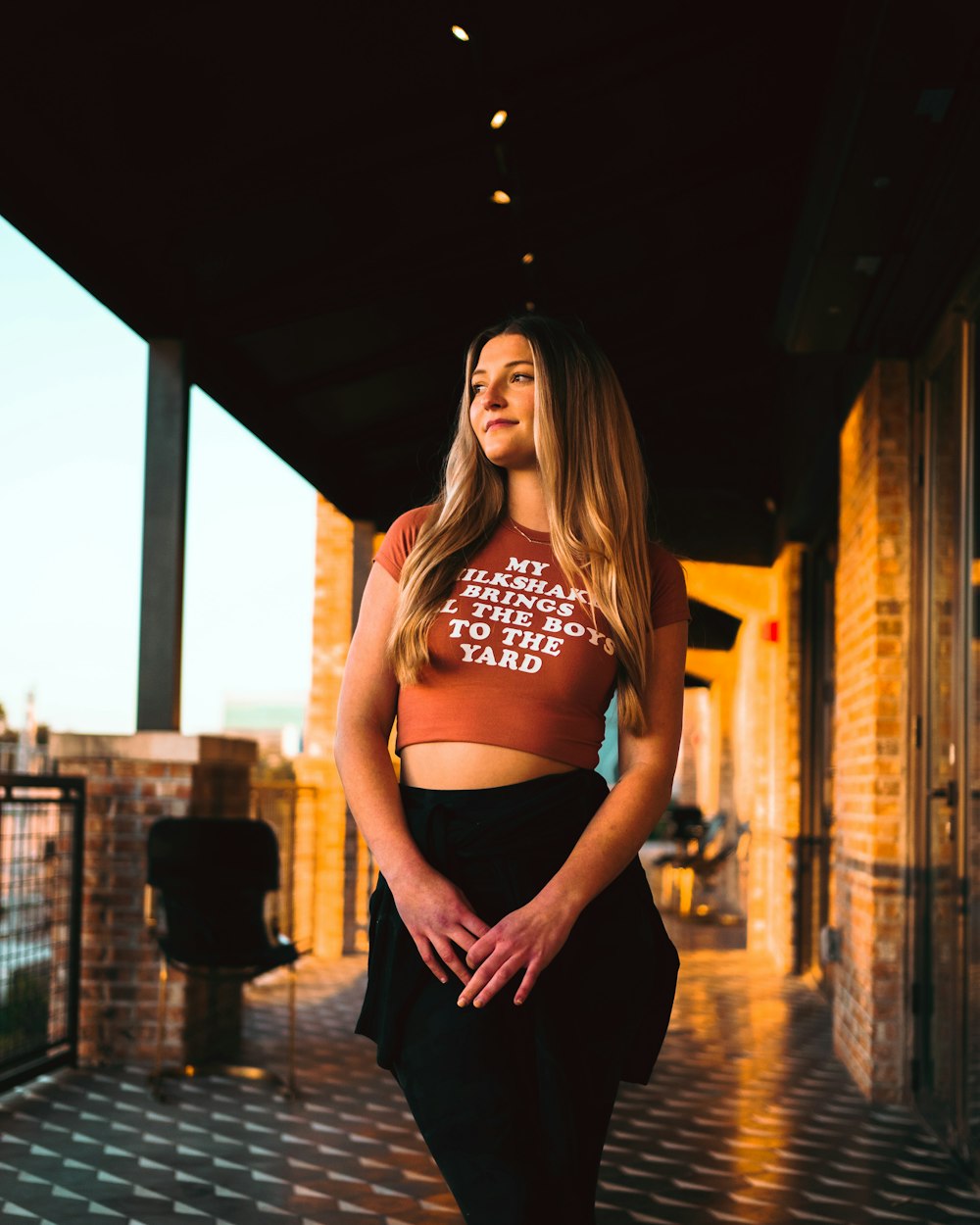 a woman posing for a picture wearing a crop top