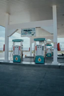 a couple of gas pumps sitting next to each other