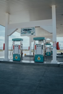a couple of gas pumps sitting next to each other