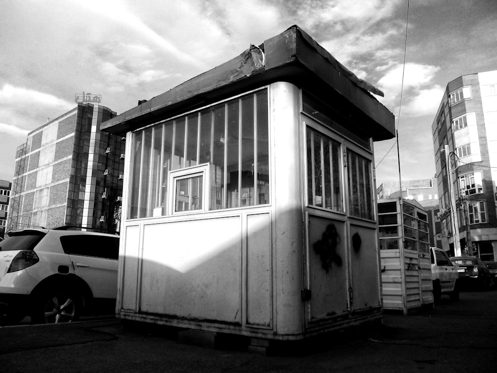 a black and white photo of a small building