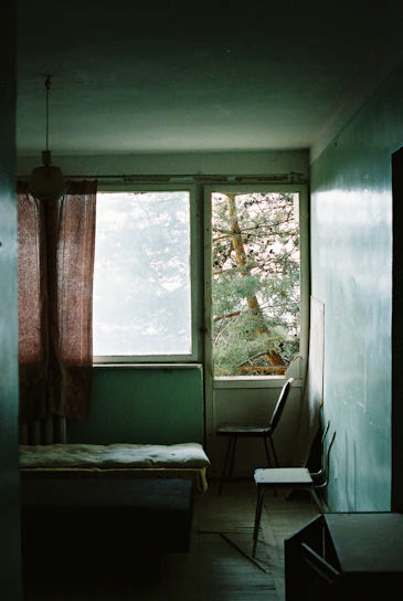 A calm therapy room with soft green lighting and natural wooden furniture, evoking serenity.