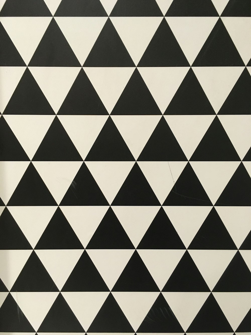 a black and white pattern with triangles on it