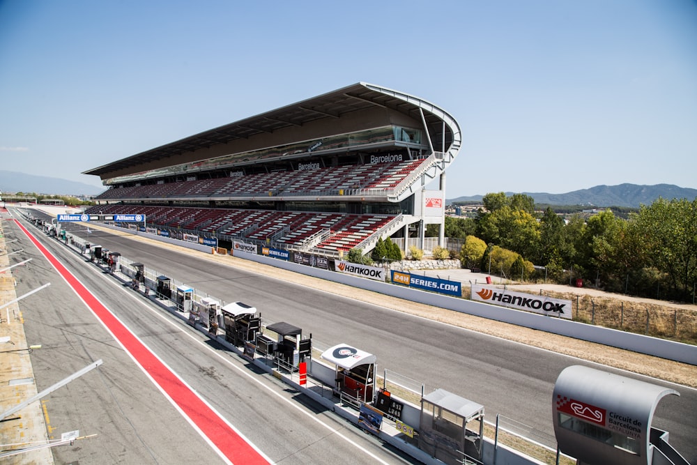 a long line of trucks parked on a race track