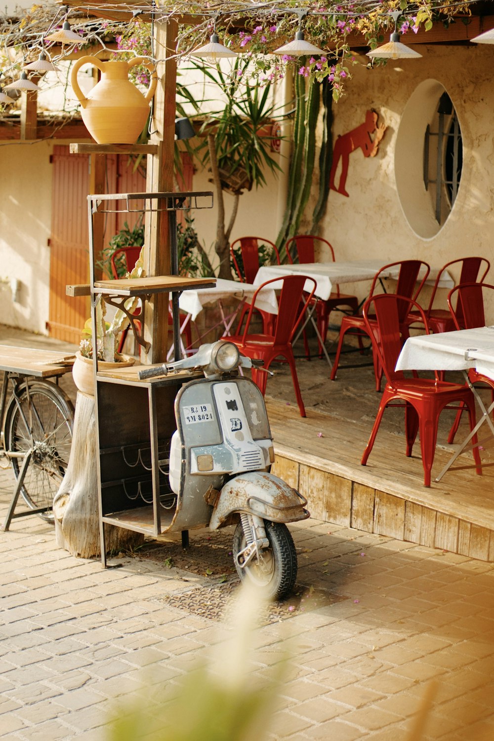 a scooter is parked in front of a restaurant