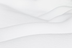 a person skiing down a snow covered slope