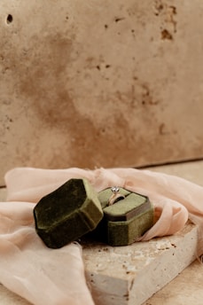 Elegant diamond engagement ring resting on a velvet cushion