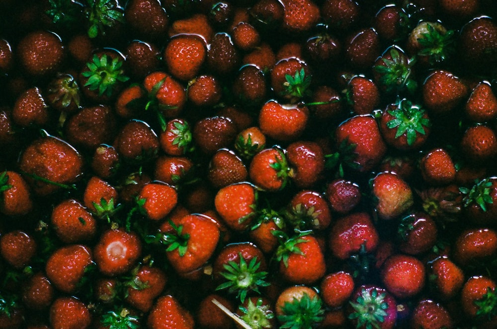 a bunch of strawberries that are in a bowl
